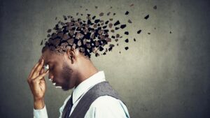 black man with fragments coming out of his head, like stress.